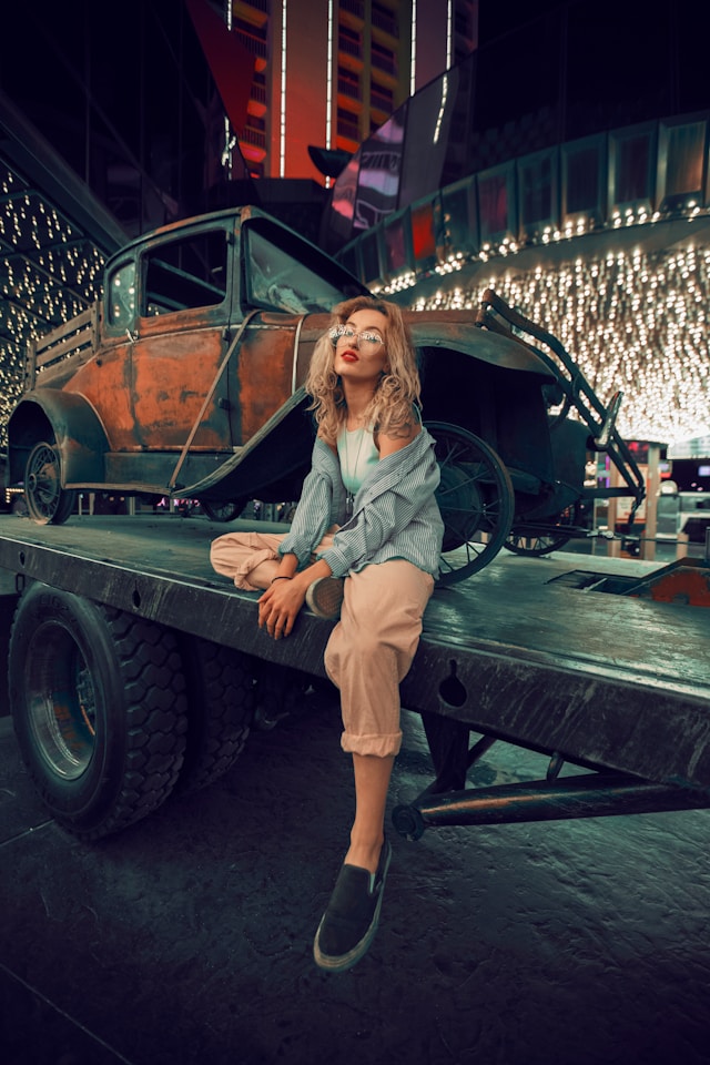 Nighttime Serenity: Woman&rsquo;s solitude on a utility trailer